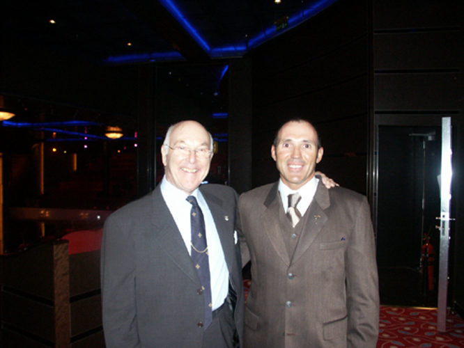 The great Murray Walker and myself at the launch of QM2 2004 IN sOUTHAMPTON