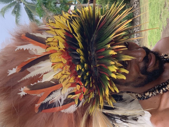 Beautiful head dress of this Oro tribesman- I love this photo