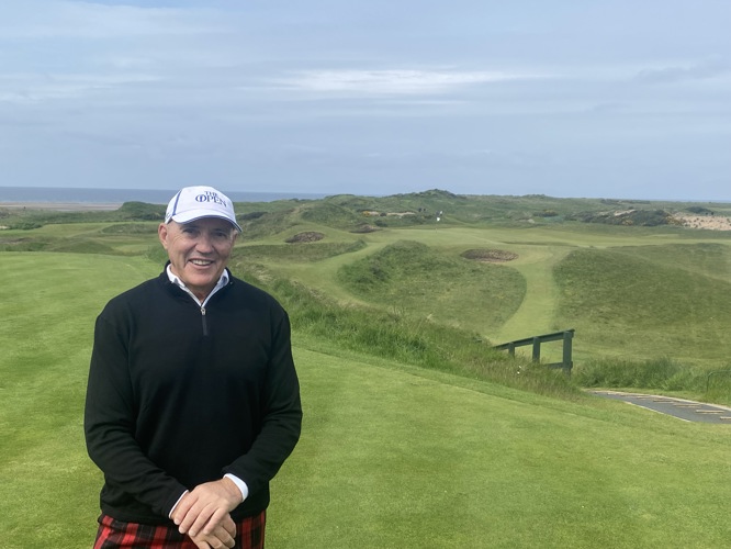 Looking happy after hitting a 9 iron close to the pin on the Postage Stamp Troon