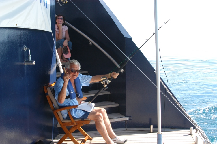 Iconic photo of Bob fishing off the back of the ship
