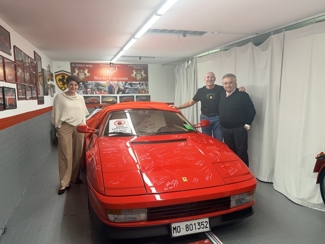 Lello Apicella owner of Lo Smeraldo restaurant Maranello showing us his Ferrari signed by all Ferrari F1 drivers